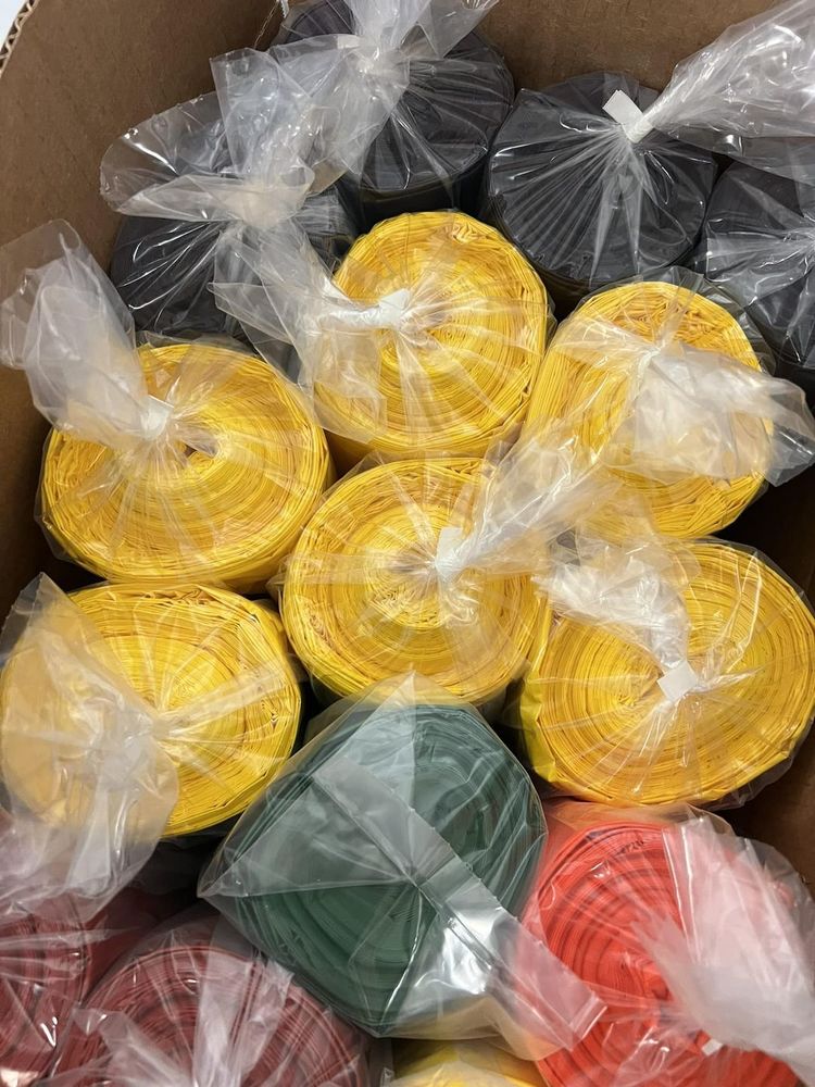 bundles of multi-colored trash bags